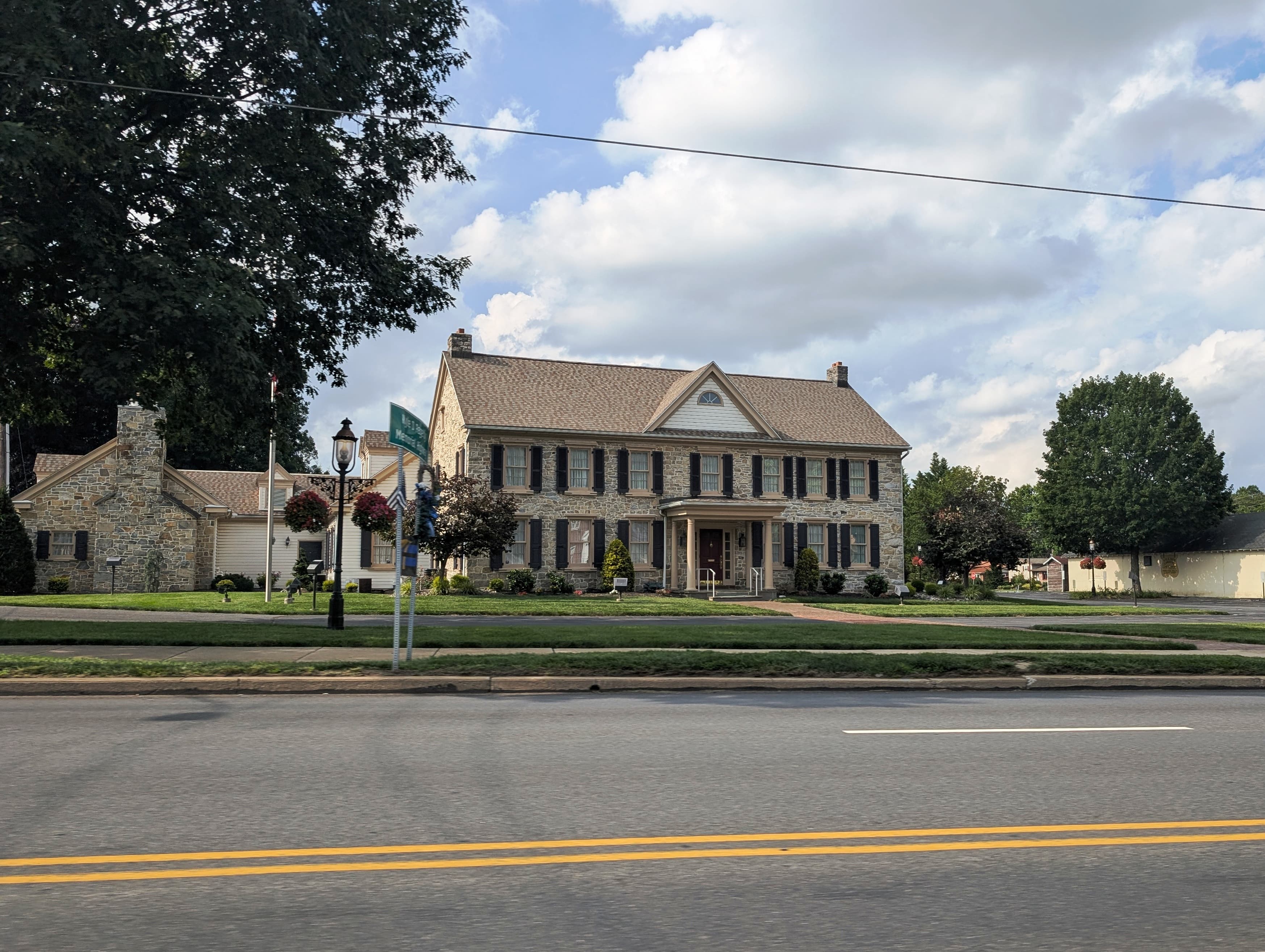 Stone exterior of Bean Funeral Homes on Penn Avenue in Sinking Spring, photographed in July 2025.